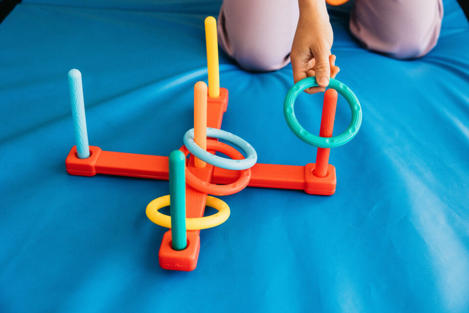 Child-Playing-Ring-Toss