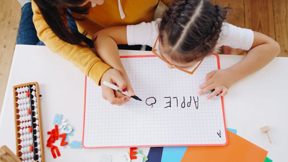 Understanding, Recognising, and Managing Dysgraphia 2 Child at speech therapy practising writing