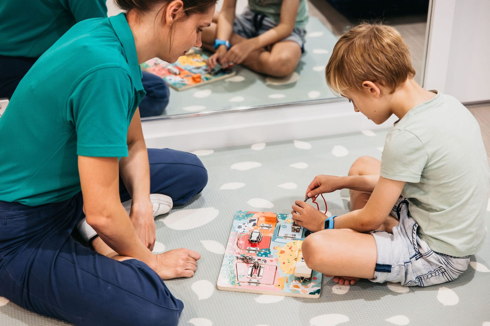 Child playing puzzle for gross motor skills