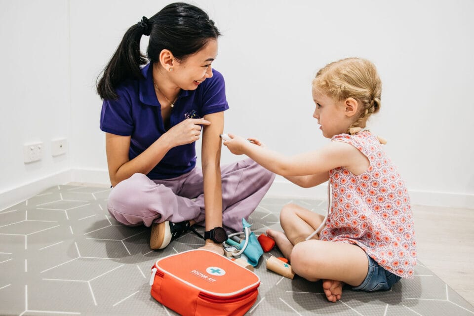 Children playing with doctor kit