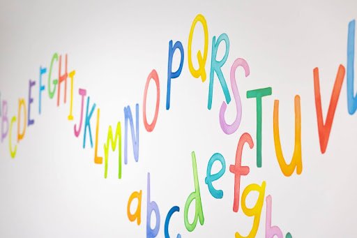 Understanding the Role of a Speech Pathologist for Children 5 Painted alphabet in billylids therapy brisbane clinic