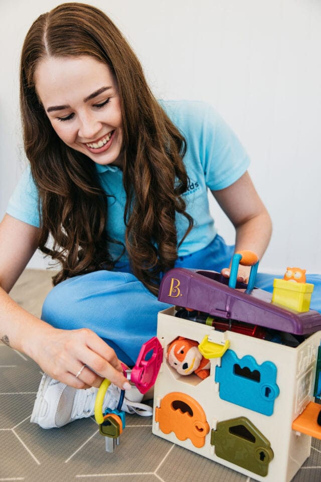 Speech Pathologist with Busy Board