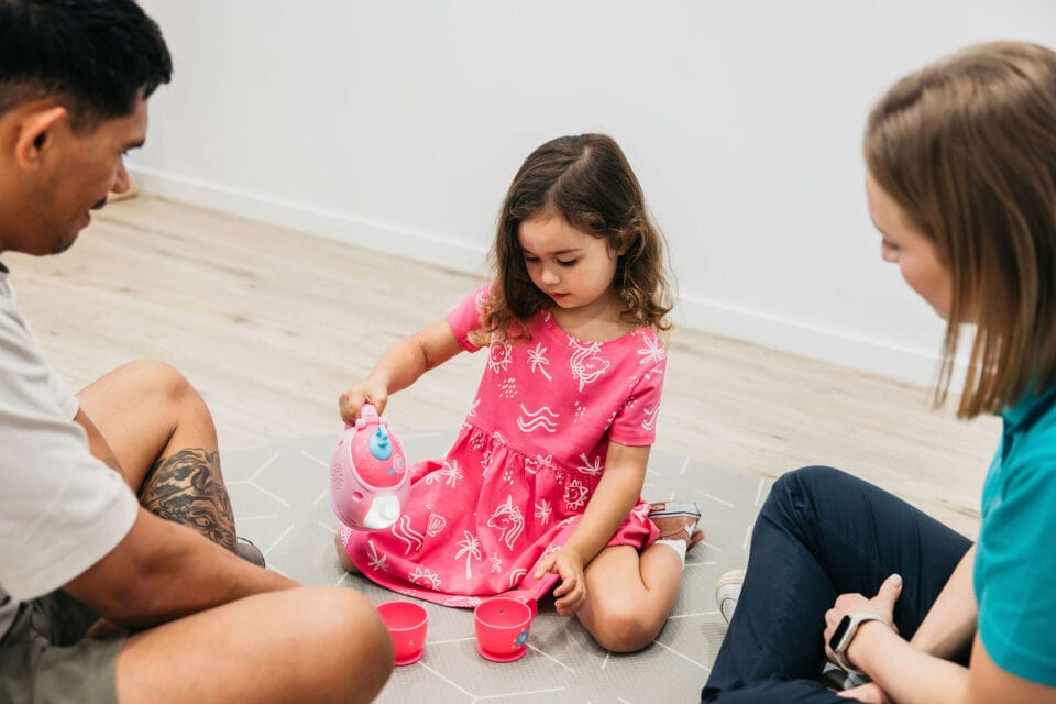 Play Matters: Occupational Therapy Insights 1 child playing with tea cups in occupational therapy